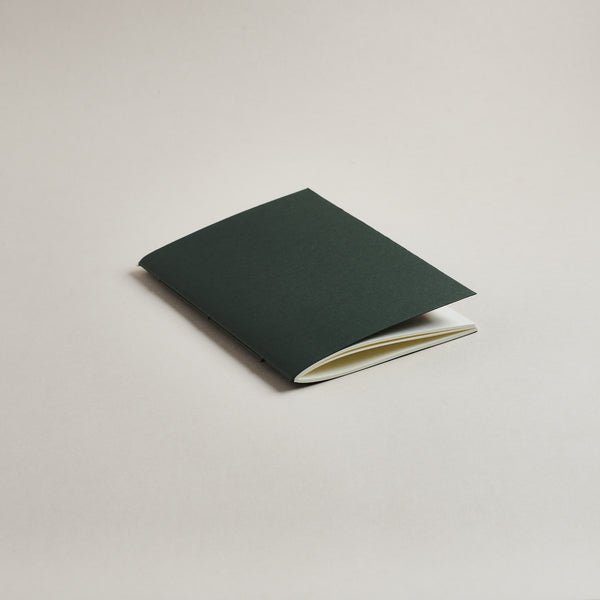 A6 Sequoia Green pocket notebook on a light gray background