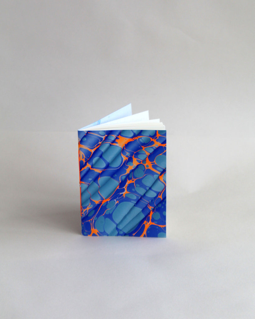 A6 notebook, featuring hand-marbled Rockpool design by Marmor Paperie for Mark+Fold, using the Spanish Wave technique of traditional paper marbling. 48 pages 120gsm fountain pen friendly paper.