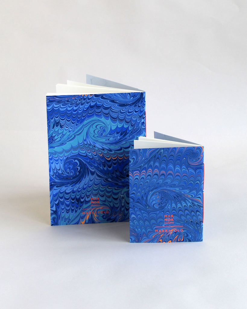 Pair of notebooks in A5 and A6, featuring hand-marbled wave design by Marmor Paperie for Mark+Fold, using the french curl ebru turkish marbling technique.