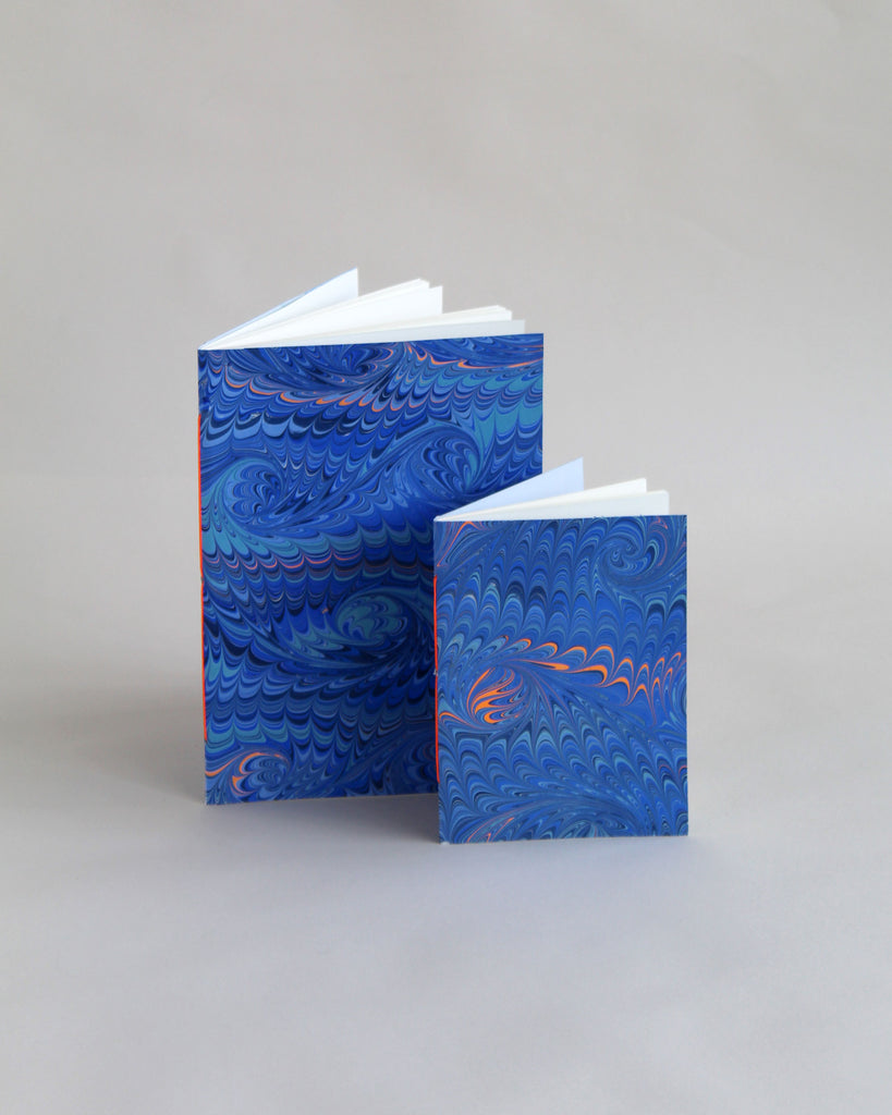 Pair of notebooks in A5 and A6, featuring hand-marbled wave design by Marmor Paperie for Mark+Fold, using the french curl ebru turkish marbling technique