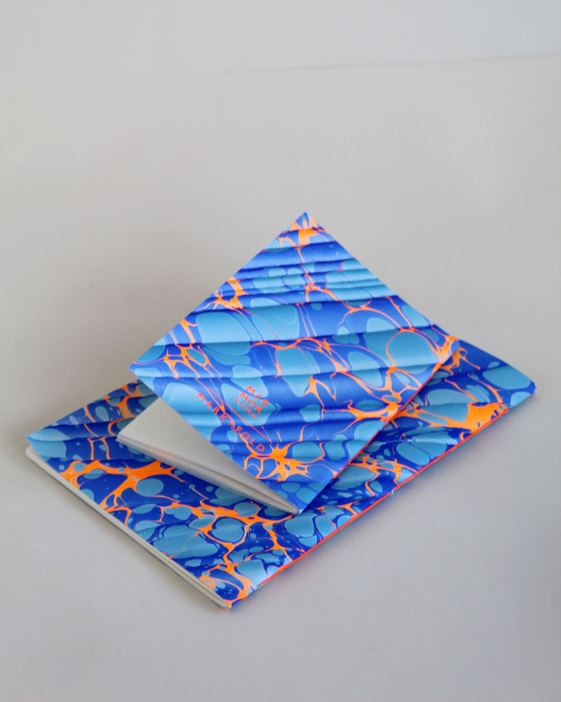 Pair of notebooks in A5 and A6, featuring hand-marbled Rockpool design by Marmor Paperie for Mark+Fold, using the Spanish Wave technique of traditional paper marbling. 48 pages 120gsm fountain pen friendly paper.