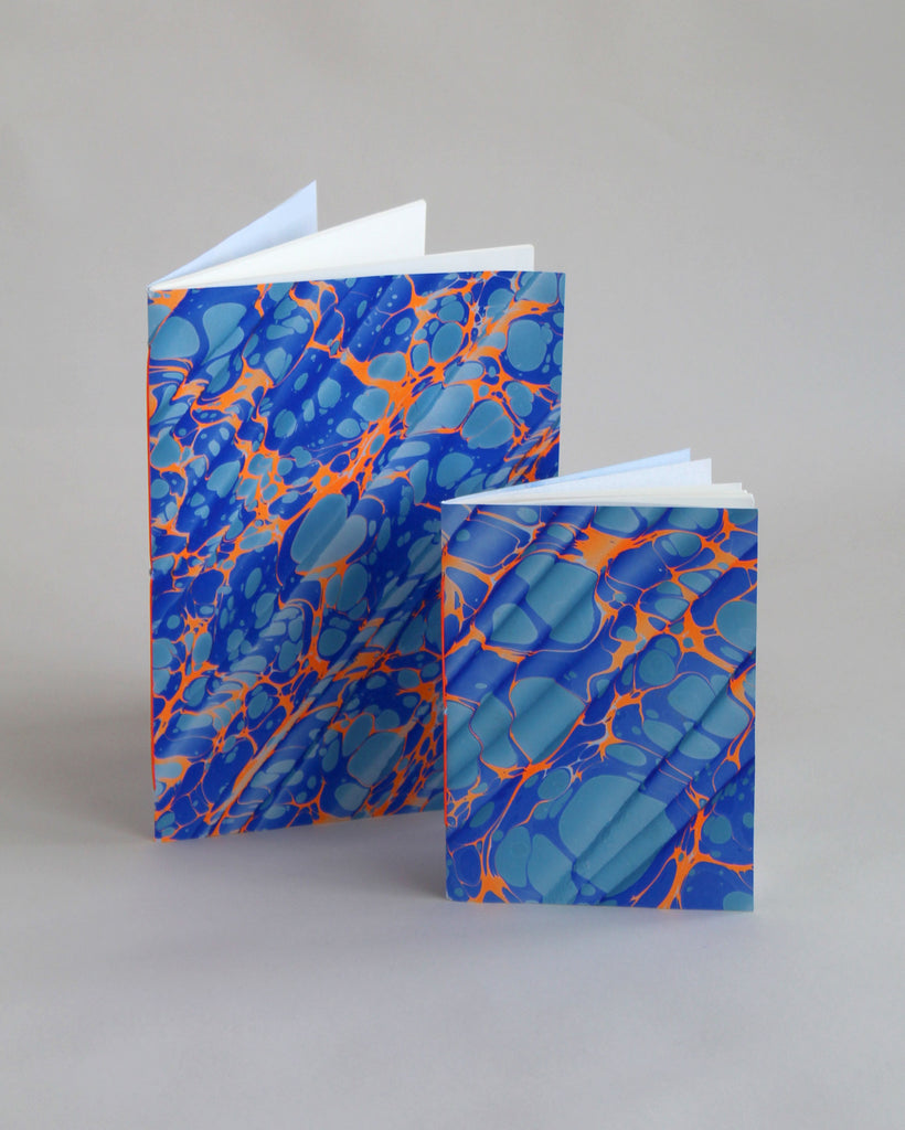 Pair of notebooks in A5 and A6, featuring hand-marbled Rockpool design by Marmor Paperie for Mark+Fold, using the Spanish Wave technique of traditional paper marbling. 48 pages 120gsm fountain pen friendly paper.