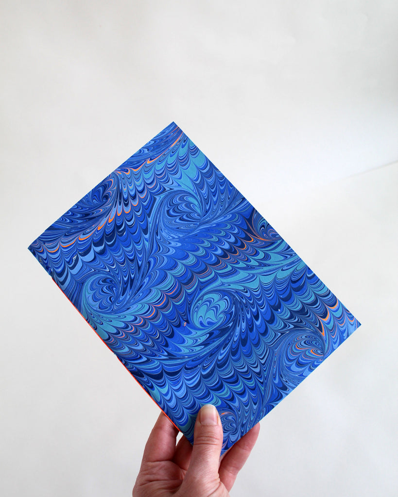 A5 notebook, featuring hand-marbled wave design by Marmor Paperie for Mark+Fold, using the french curl ebru turkish marbling technique