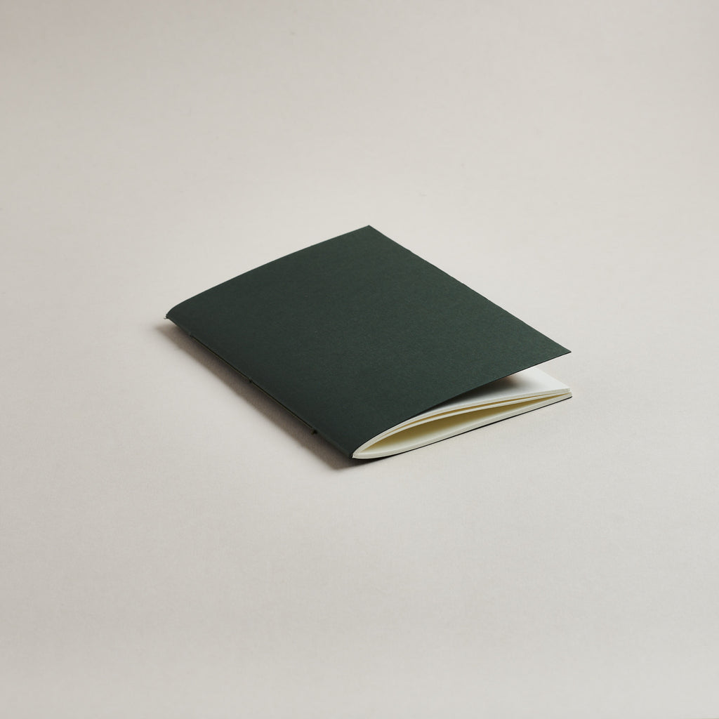 A6 Sequoia Green pocket notebook on a light gray background