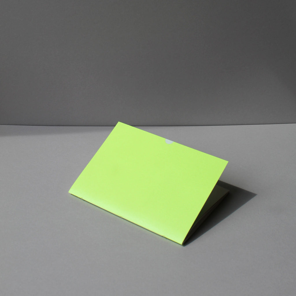 Hand-bound A5 Exercise book with plain pages. Cover in tennis ball neon, with white foil thumbcut detail