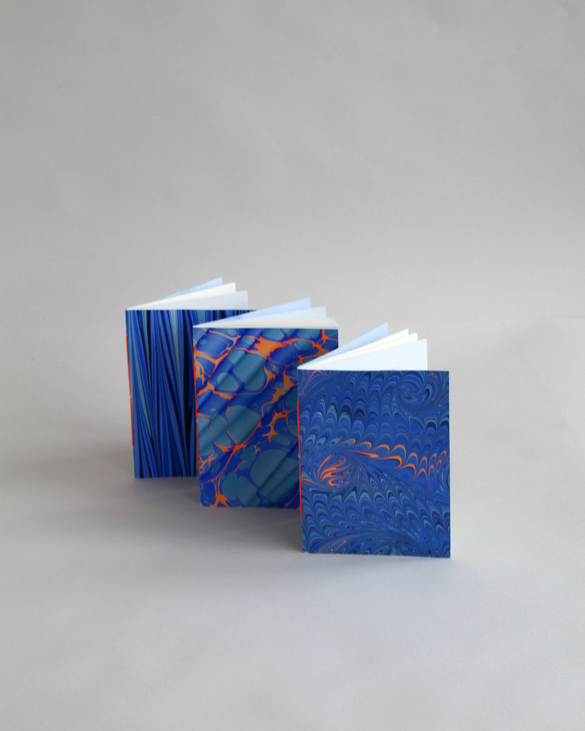 Set of 3 A6 Marmor for Mark+Fold hand-marbled notebooks, 48 pages fountain pen friendly paper, bound in suffolk UK.
