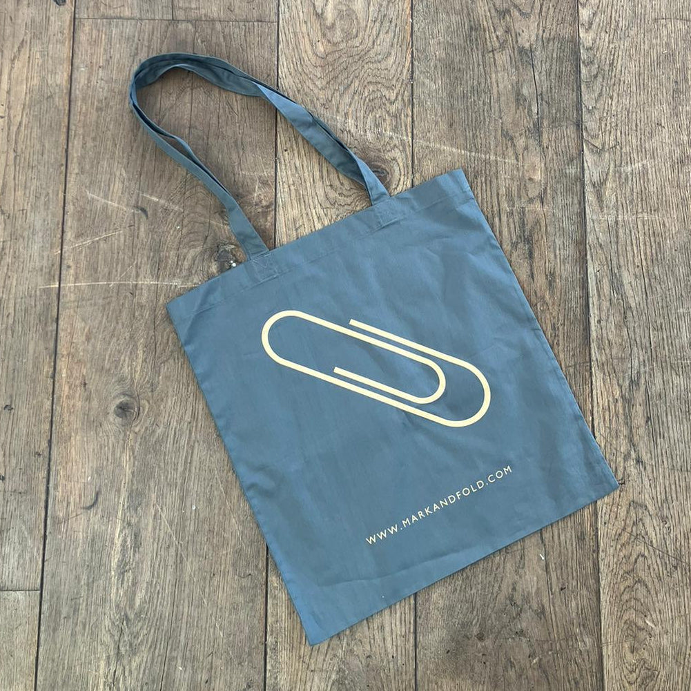 Tote bag with a logo on a wooden floor
