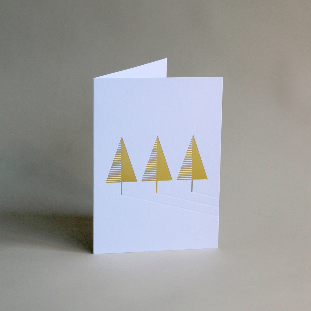 Christmas card with gold foiled tree and blind debossed shadows. Printed in Scotland on GF Smith Colorplan Whte Frost.