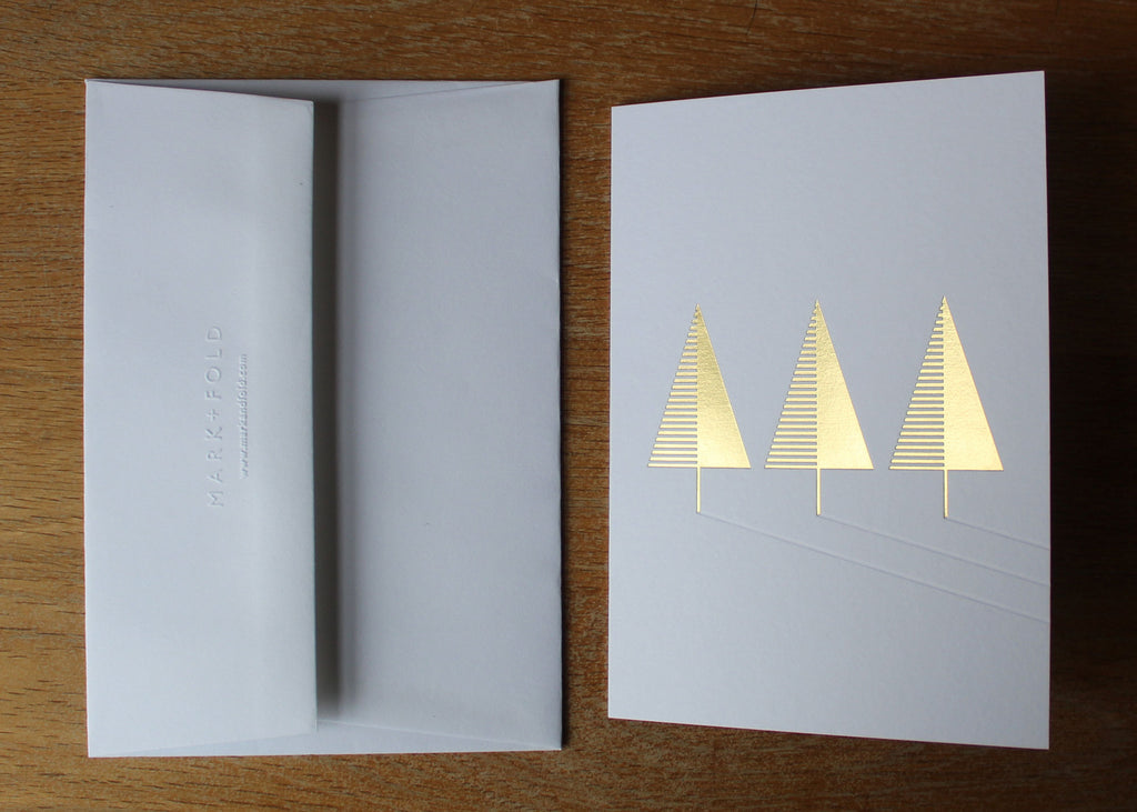 Mark+Fold Christmas card, gold foiled tree and blind debossed shadows. Printed in Scotland on GF Smith Colorplan Whte Frost. Matching envelope hand-made in Hull and embossed at the Mark+Fold studio