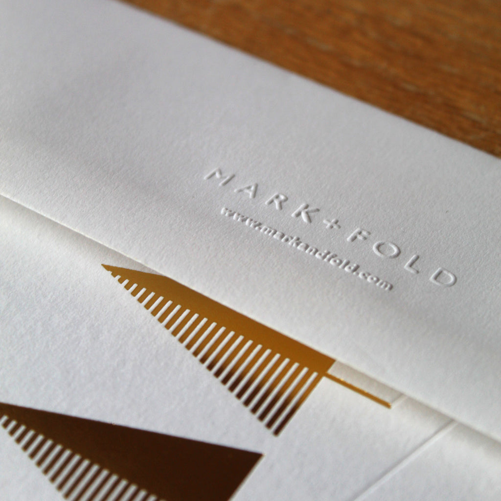 Close up of embossed Mark+Fold envelope, white frost colorplan made in UK