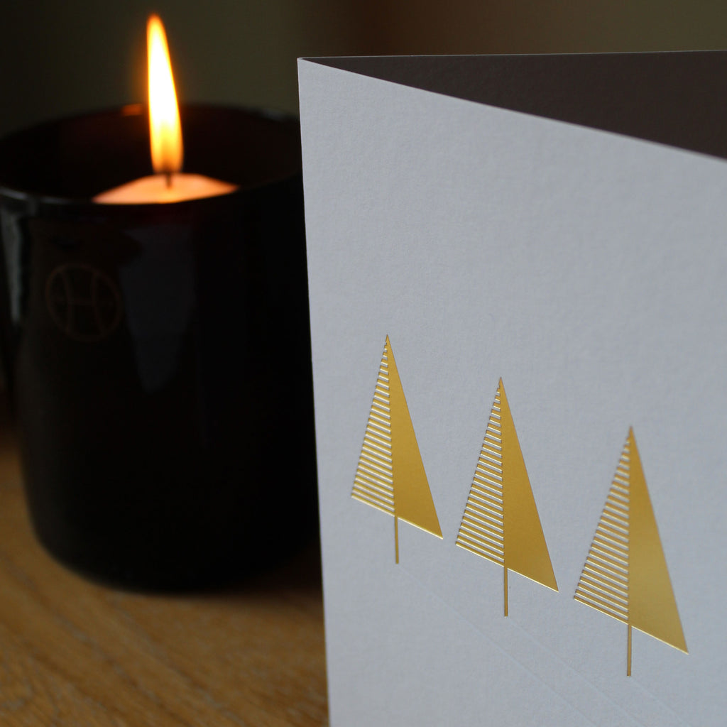 Christmas card with gold foiled tree and blind debossed shadows. Printed in Scotland on GF Smith Colorplan Whte Frost. Detail with perfumer h candle ivy