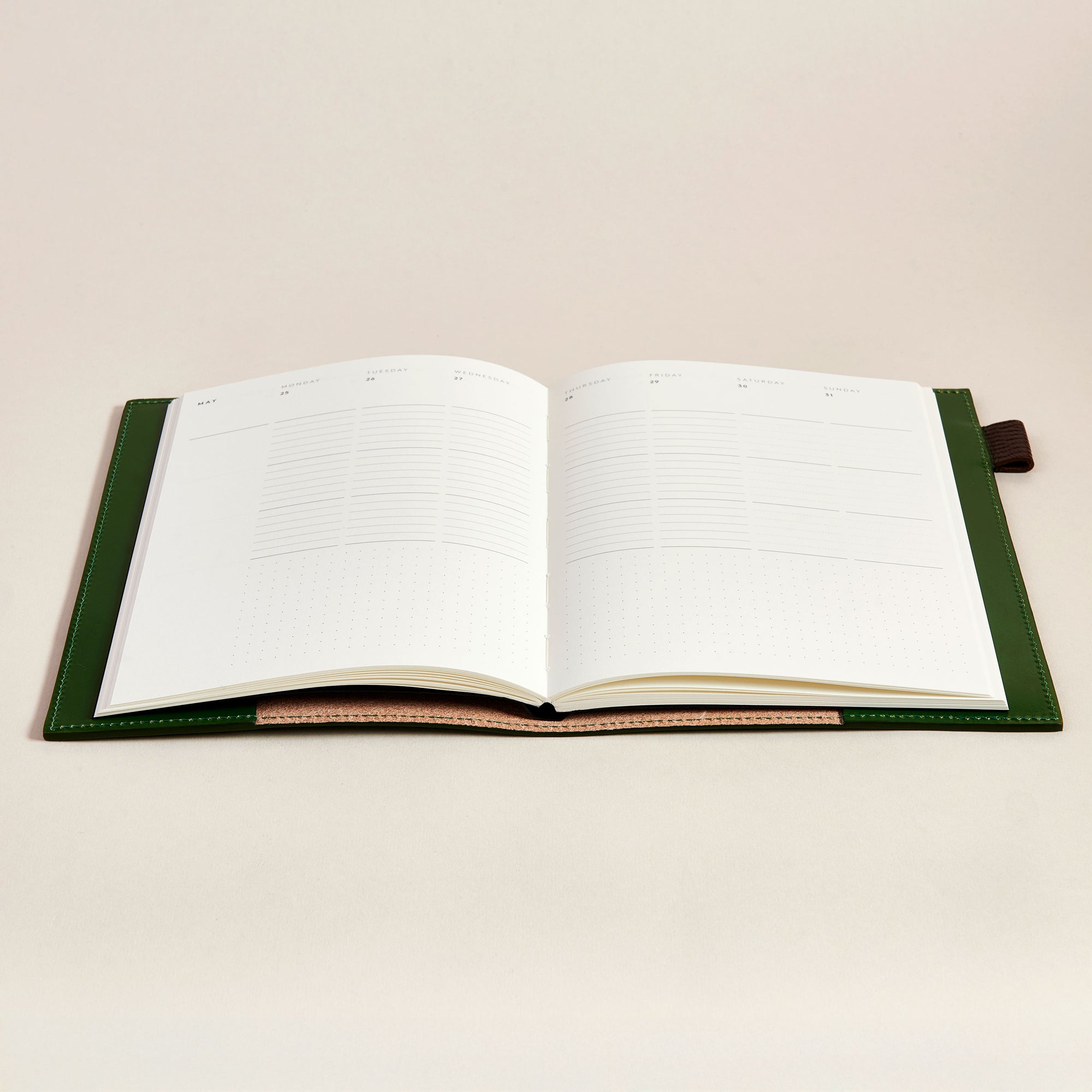 Open notebook with green leather notebook cover
