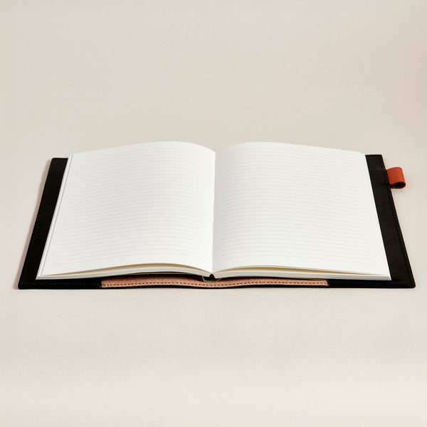 Open notebook with black leather notebook cover