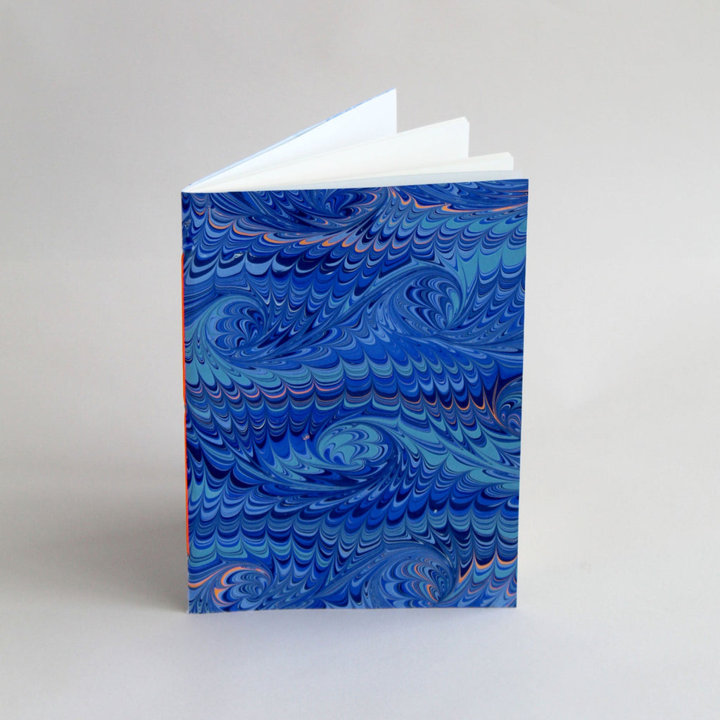 A5 notebook, featuring hand-marbled wave design by Marmor Paperie for Mark+Fold, using the french curl ebru turkish marbling technique
