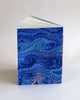 A5 notebook, featuring hand-marbled wave design by Marmor Paperie for Mark+Fold, using the french curl ebru turkish marbling technique