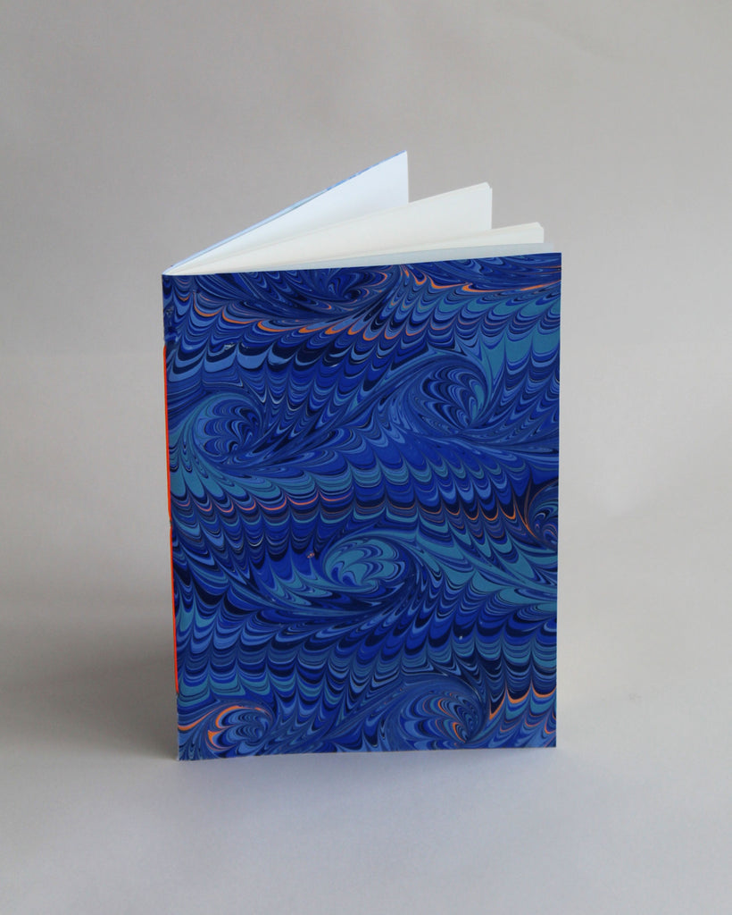 A5 notebook, featuring hand-marbled wave design by Marmor Paperie for Mark+Fold, using the french curl ebru turkish marbling technique
