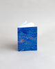 A6 notebook, featuring hand-marbled wave design by Marmor Paperie for Mark+Fold, using the french curl ebru turkish marbling technique
