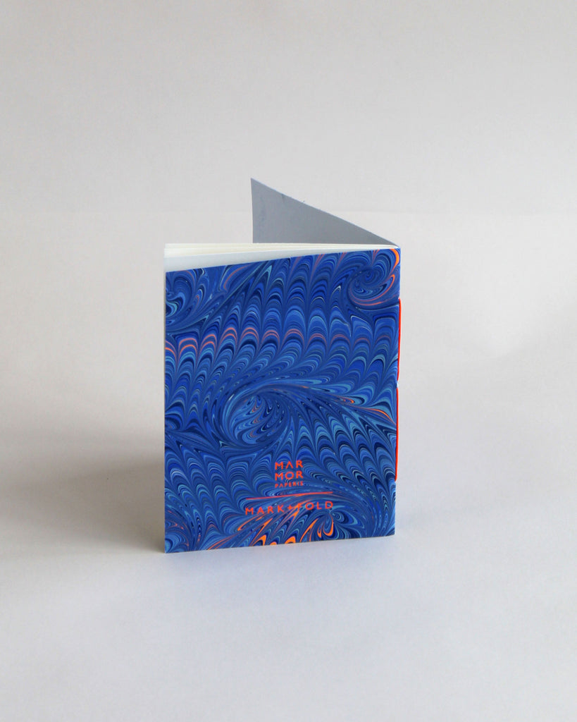 A6 notebook, featuring hand-marbled wave design by Marmor Paperie for Mark+Fold, using the french curl ebru turkish marbling technique