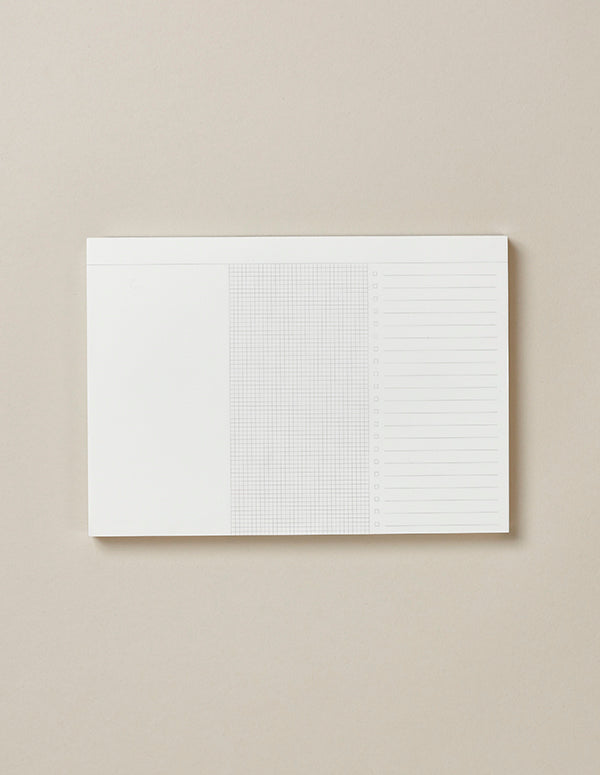 The Mark+Fold desktop Planner Pad. Divided into 3 columns, the Planner Pad is designed to promote better organisation and spark creativity, with a blank white column, a gridded area for sums and sketches, and a list column with satisfying tick boxes.