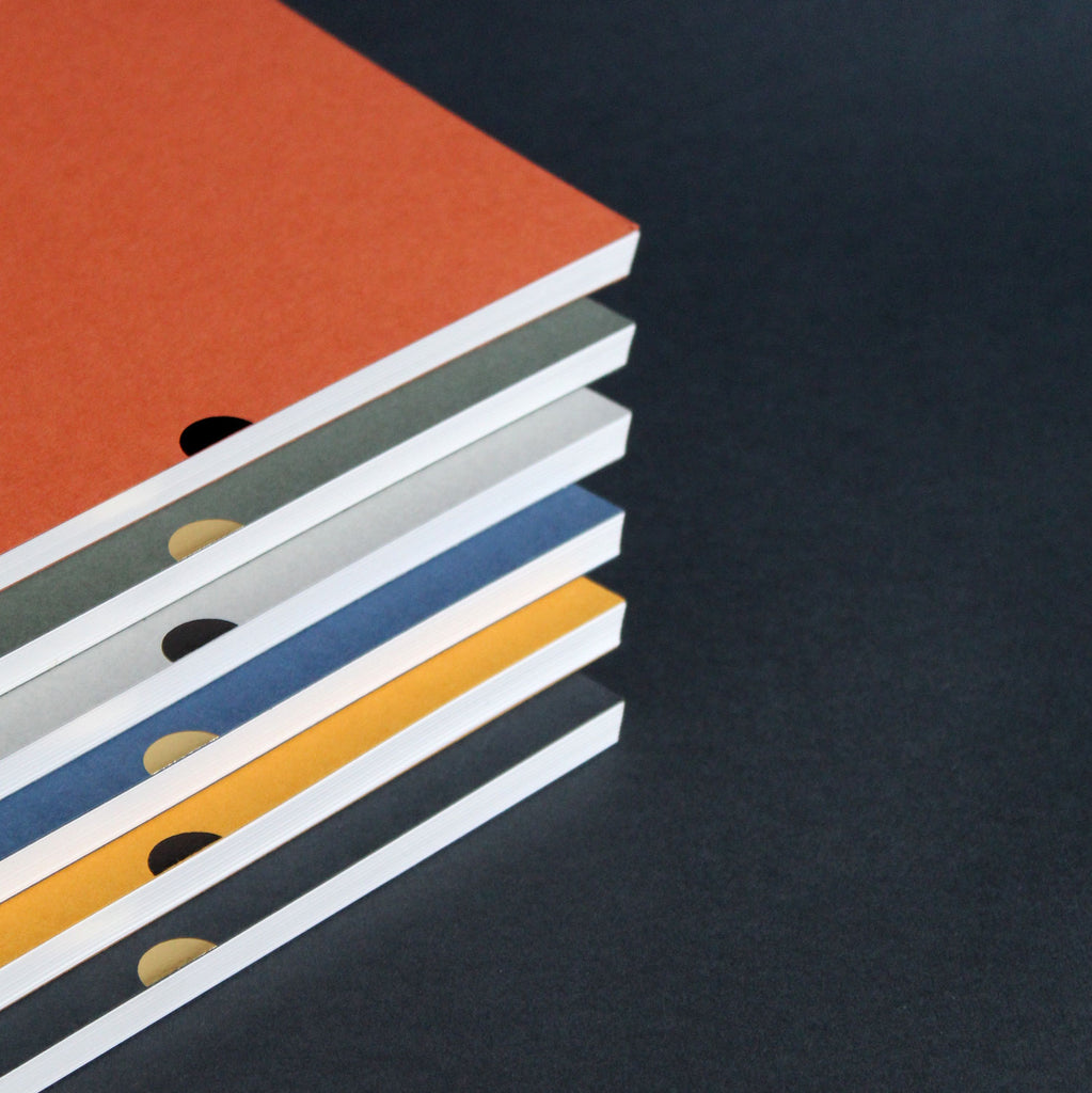 Mark+Fold layflat notebooks, lined pages rust sequoia, dpt grid pages mustard flint, plain pages cobalt lichen
