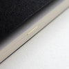 Detail of the Mark+Fold Diary with brass page marker on today's page