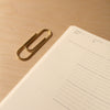 Carl Auböck Paperclip in Solid Brass, for Mark+Fold, luxury desk object, made in Vienna. With the Mark+Fold 2021 Diary minimal layflat diary eco sustainable production in Europe
