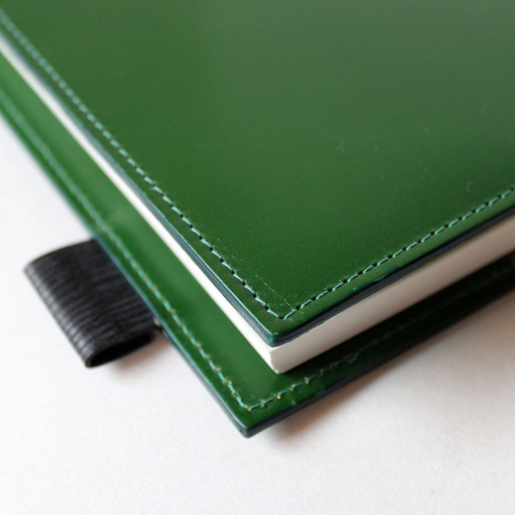 Stitching detail on the Mark+Fold avocado green leather diary cover