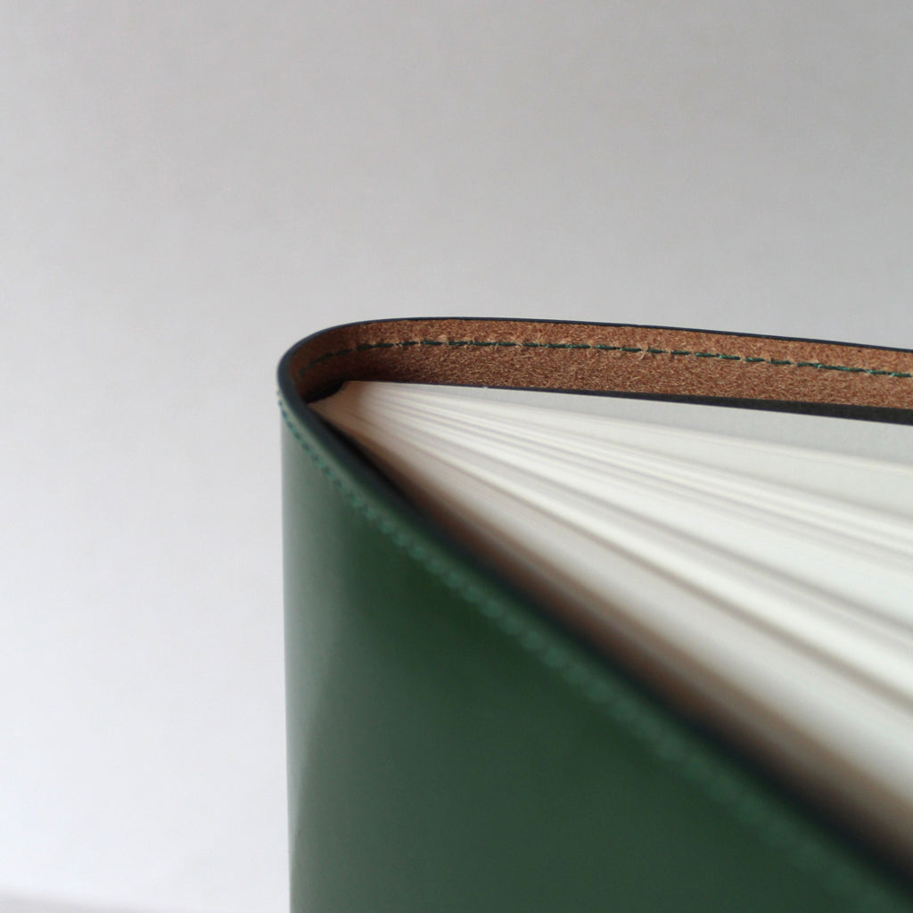 Detail of avocado green bridle leather removable notebook cover