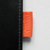 Orange leather pen loop, taken from Doe Leather's archive of rare leather swatches