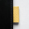Straw yellow leather pen loop, taken from Doe Leather's archive of rare leather swatches