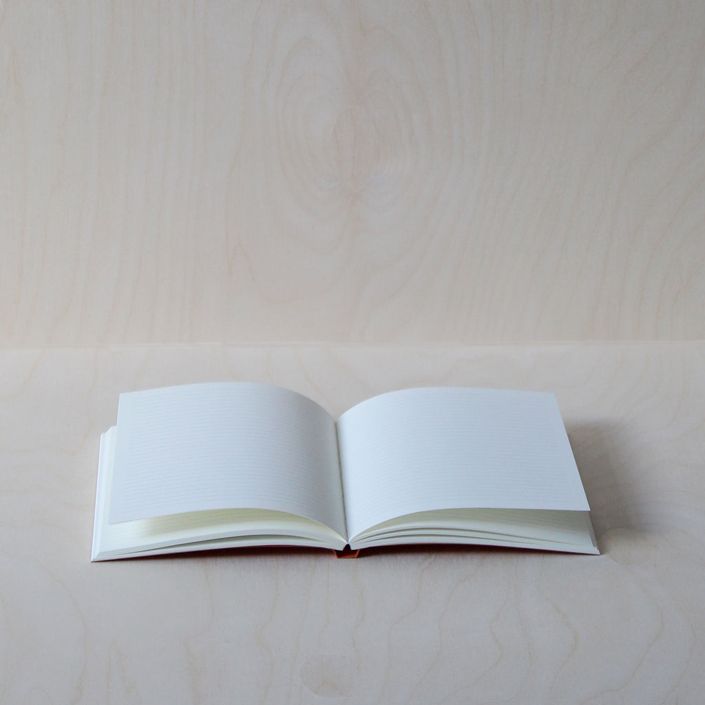 Mark+Fold's Lined notebook in Rust with black details. Layflat ota bind notebook. 120gsm smooth cream paper, suitable for fountain pen, made in Scotland. Sustainable transparenyt production. Modern stationery, designed in London.