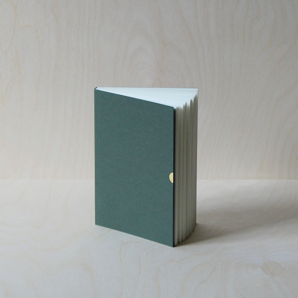 Mark+Fold's Lined notebook in Sequoia with gold details. Layflat ota bind notebook. 120gsm smooth cream paper, suitable for fountain pen, made in Scotland. Sustainable transparenyt production. Modern stationery, designed in London.